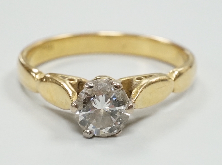 An 18ct and solitaire diamond set ring, size O, gross weight 3.6 grams.